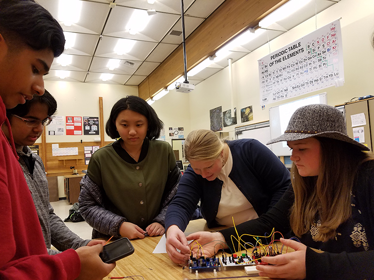 Alexandra Pike and students at Juanita High School working on circuitry unit